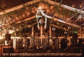 a Disco Saddle above the dance floor; Photography by Kristen Kilpatrick